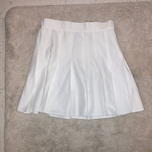 Garage: White pleated tennis skirt.